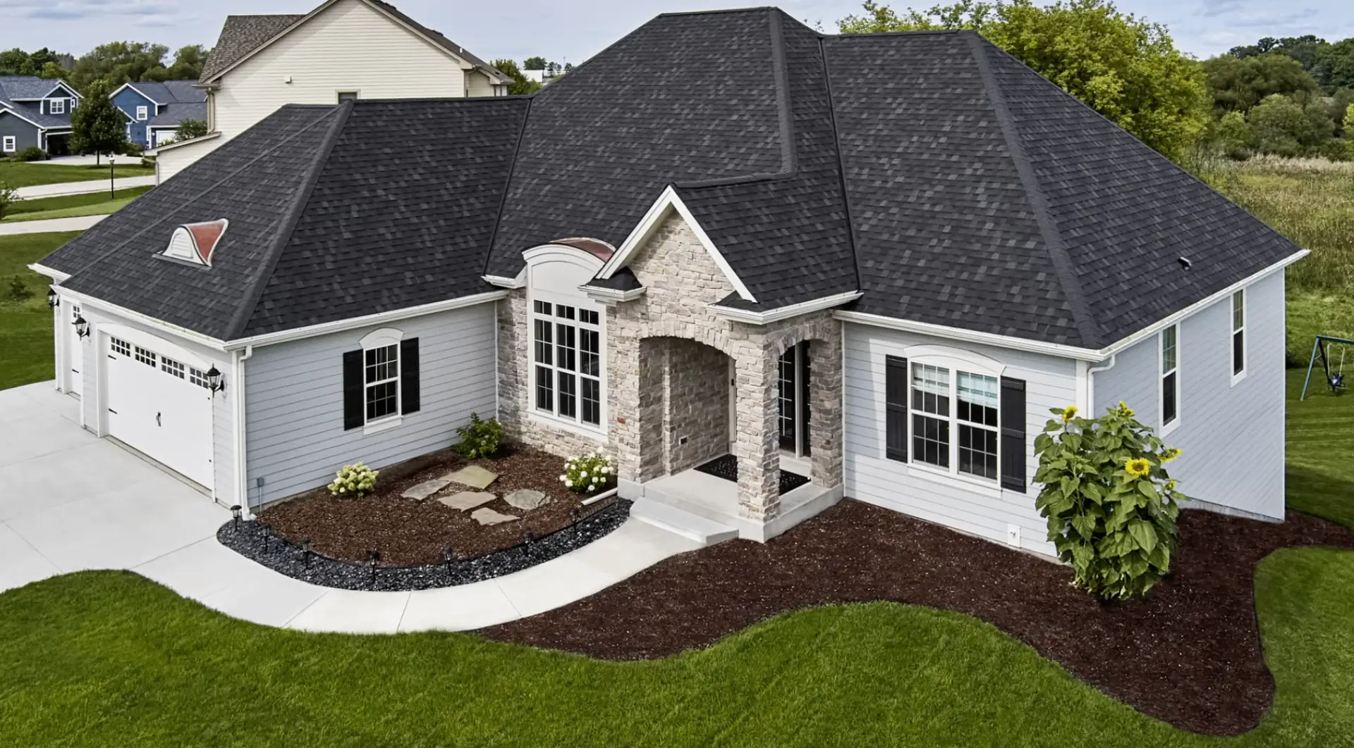 Gainesville home with dark Atlas shingle roofing shown from above