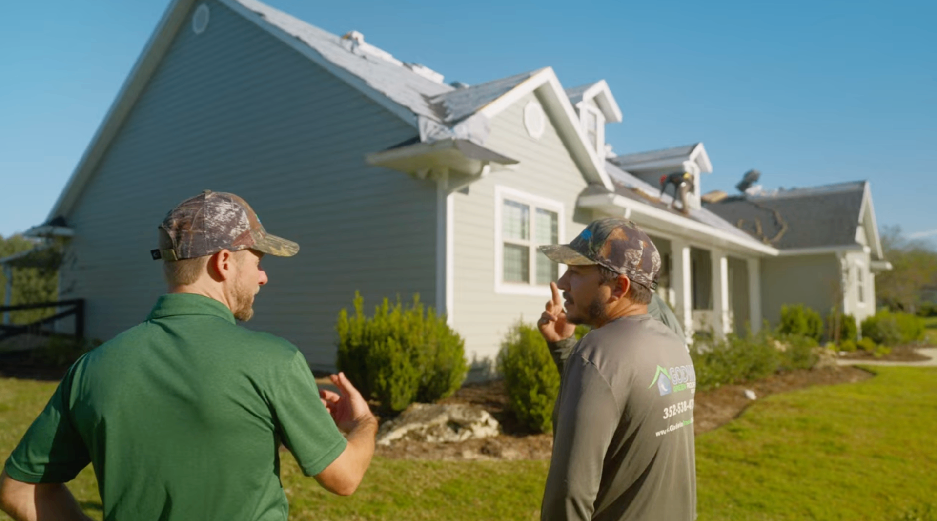 Godwin Green Roofing crew inspecting a roof in Gainesville, Florida