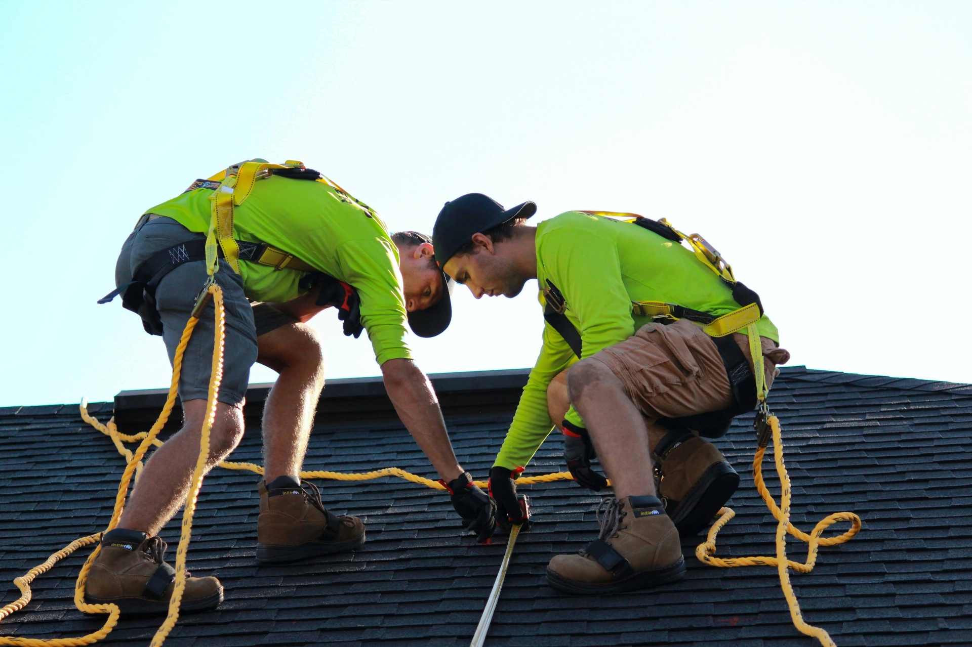 Godwin roofers installing shingles on a Florida home